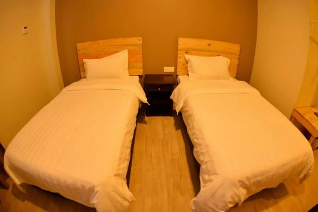 Bed in Sg. Paka Hotel