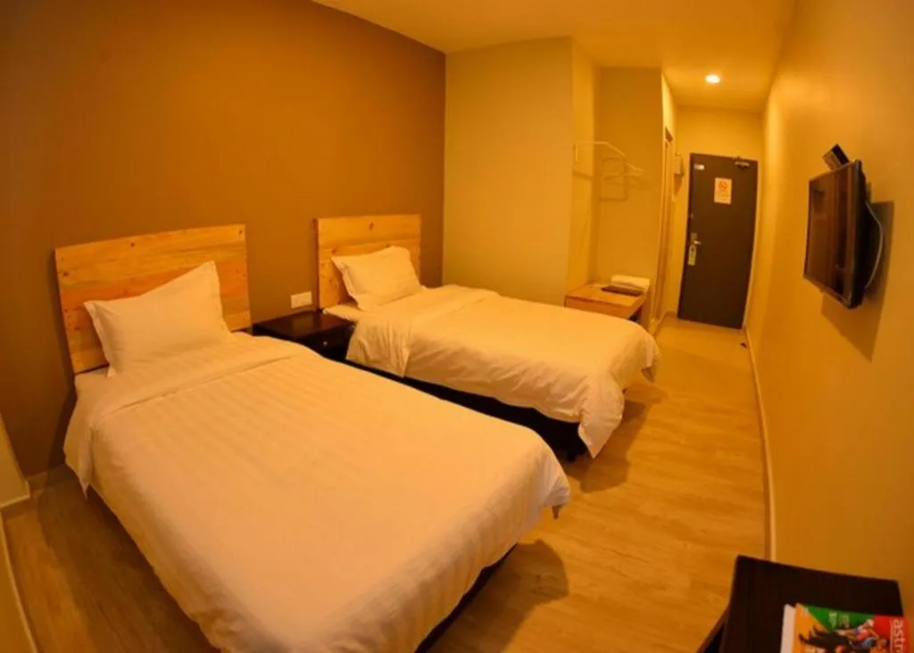 Bed in Sg. Paka Hotel