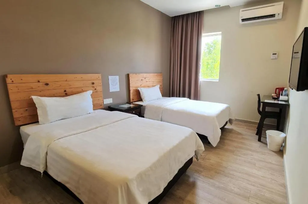 Bed in Sg. Paka Hotel