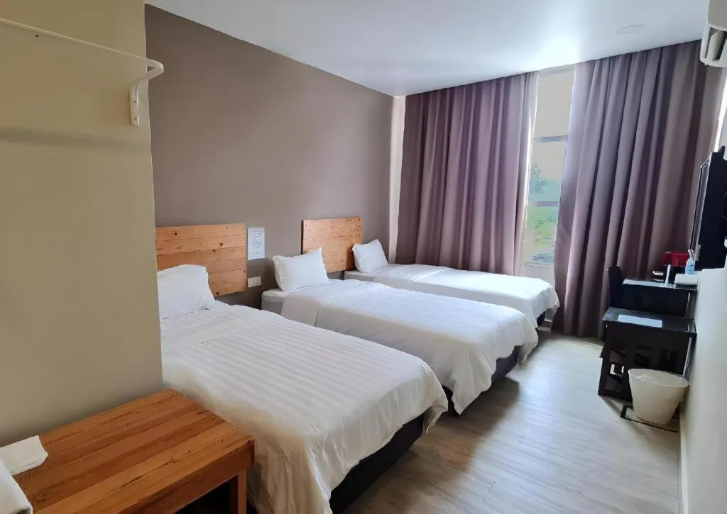 Bed in Sg. Paka Hotel