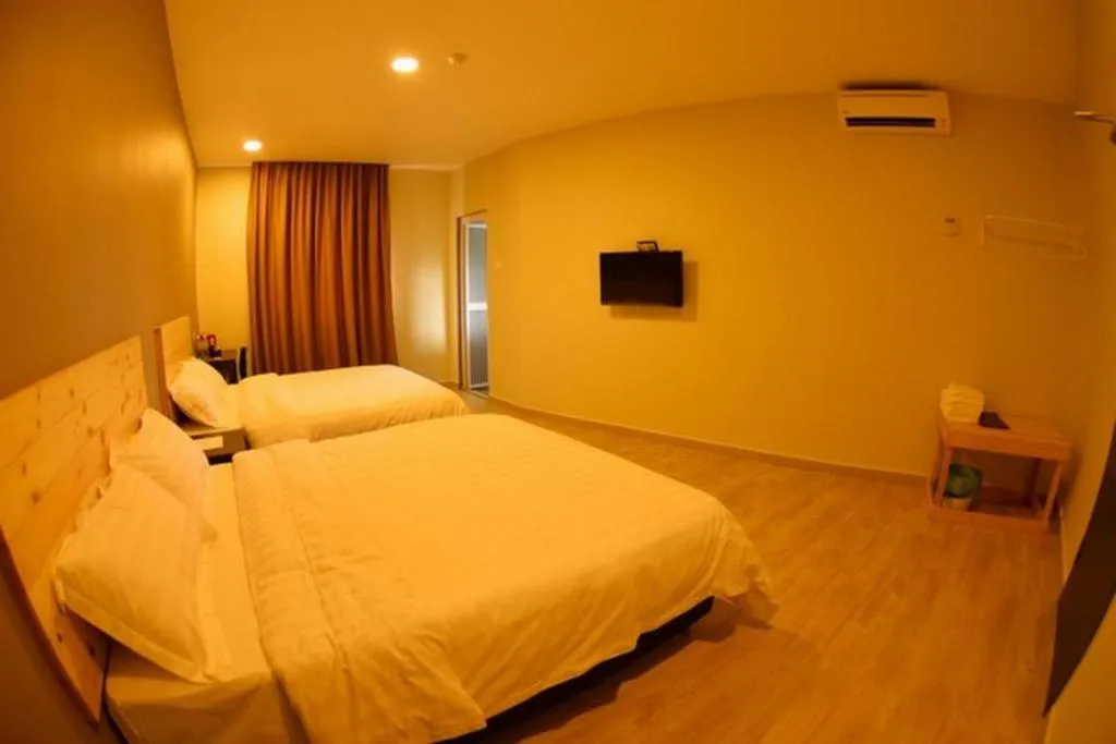 Bed in Sg. Paka Hotel