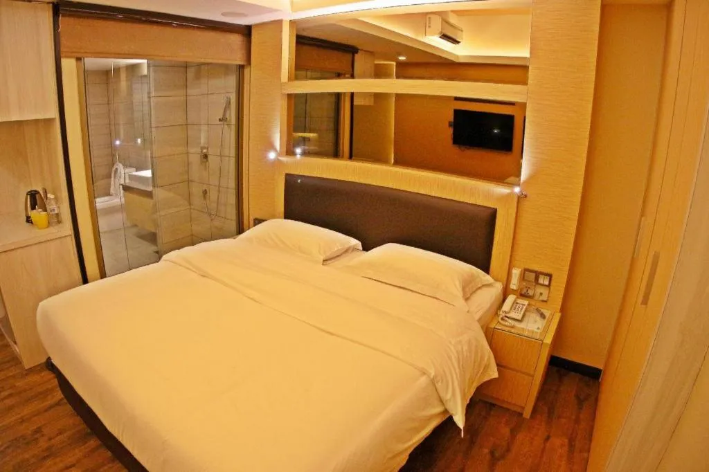 Bed in JC Mark Hotel