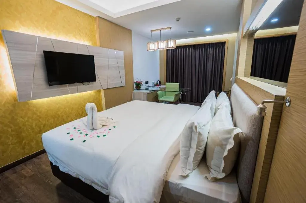 Bed in JC Mark Hotel Bed in JC Mark Hotel