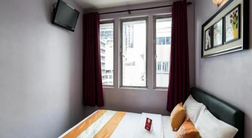 Bed in OYO 191 ML Inn Hotel