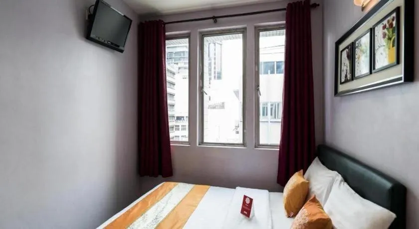 Bed in OYO 191 ML Inn Hotel