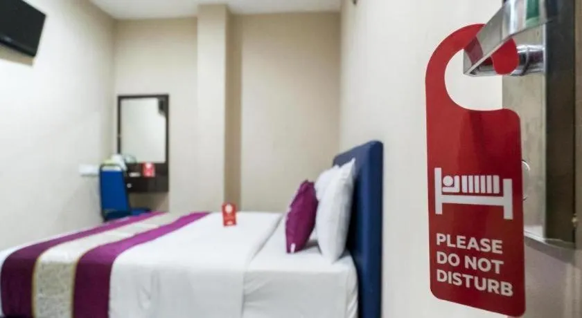 Bed in OYO 191 ML Inn Hotel