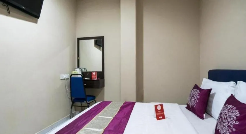 Bed in OYO 191 ML Inn Hotel