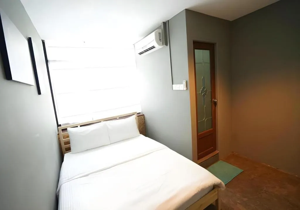 Bed in Koptel Budget Hotel