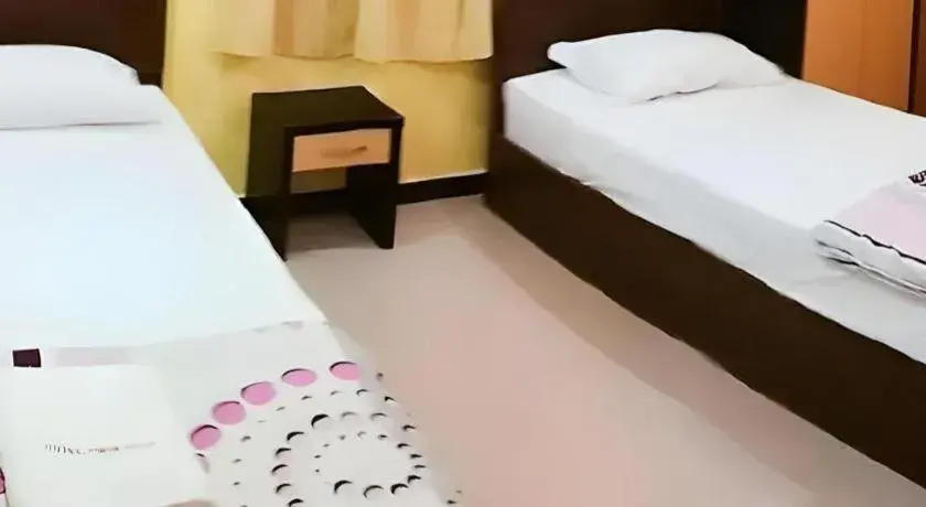 Bed in Twin Star Hotel Bed in Twin Star Hotel