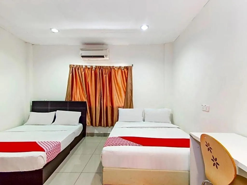 Bed in OYO 304 Zero Hour Hotel