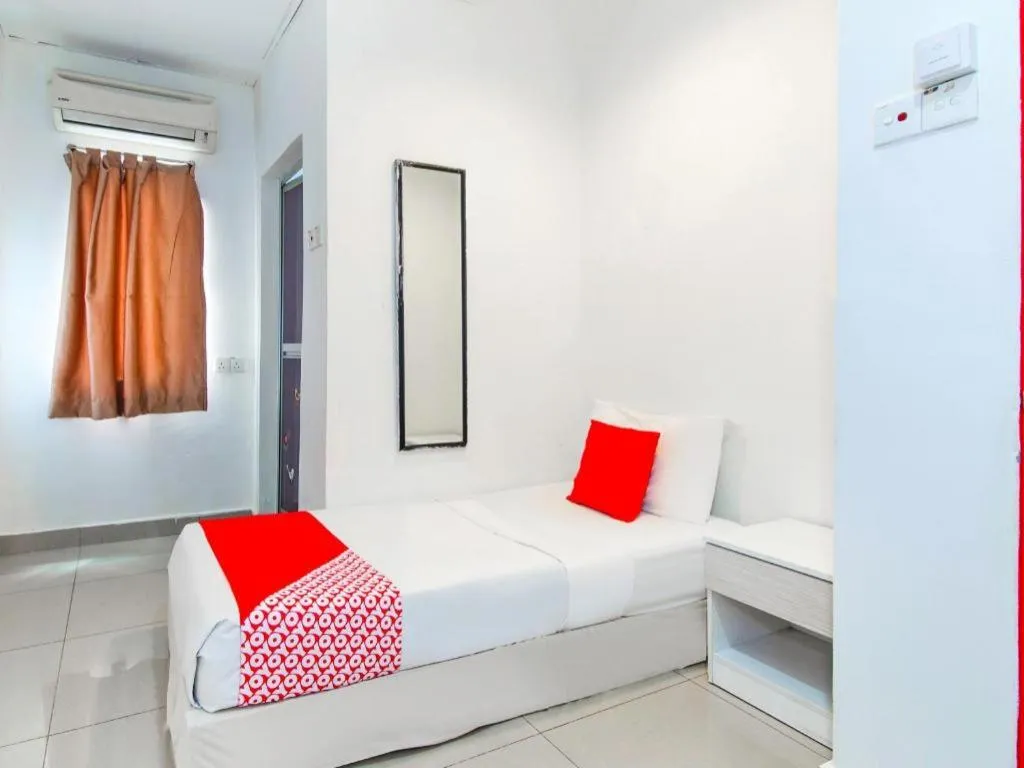 Bed in OYO 304 Zero Hour Hotel