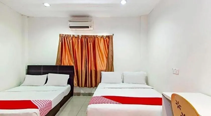 Bed in OYO 304 Zero Hour Hotel