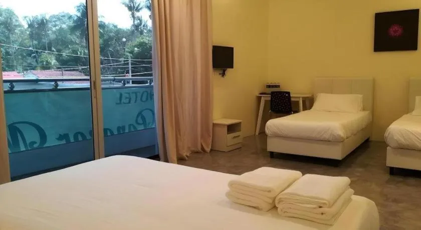 Bed in Hotel Pangkor Mutiara