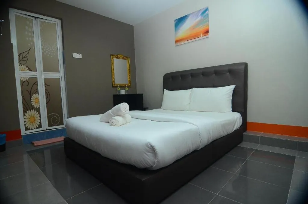 Bed in AMT BUDGET HOTEL