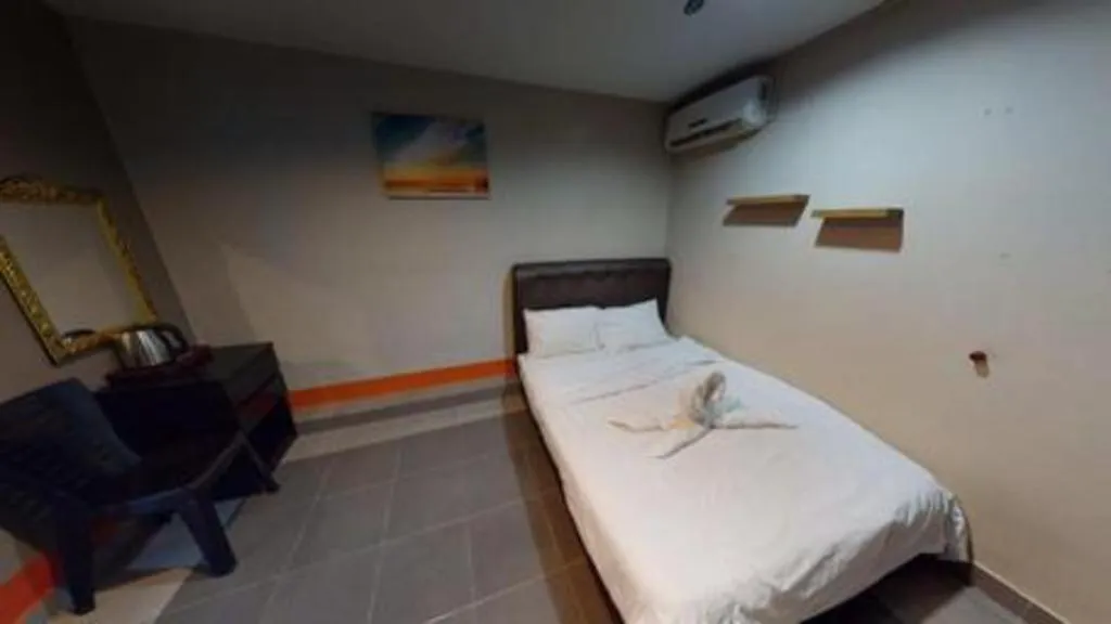 Bed in AMT BUDGET HOTEL