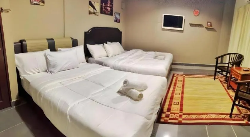 Bed in AMT BUDGET HOTEL