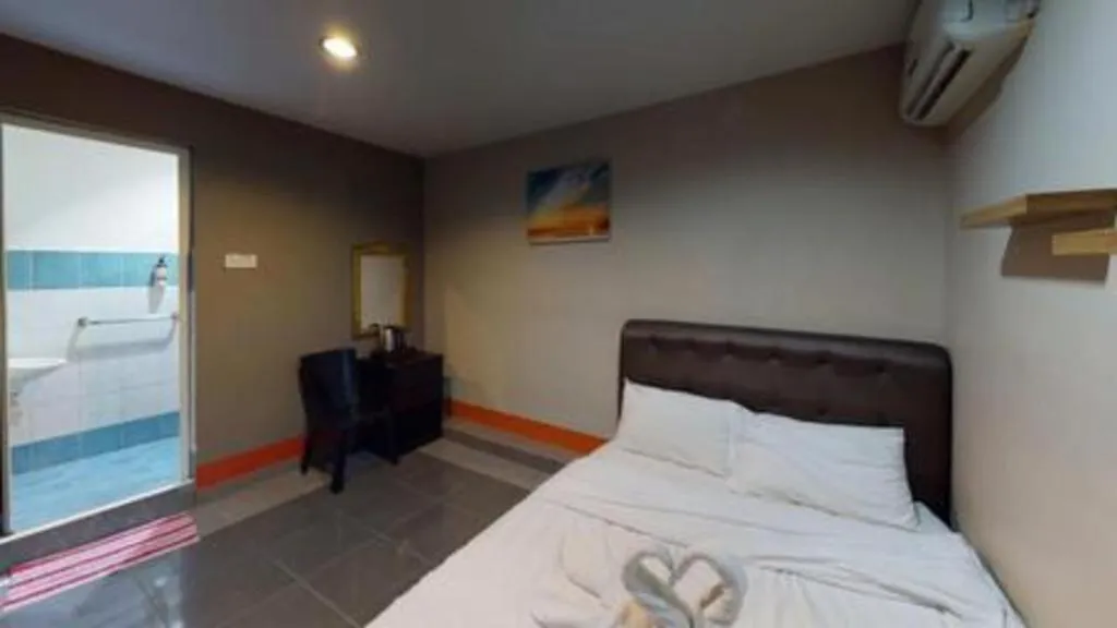 Bed in AMT BUDGET HOTEL