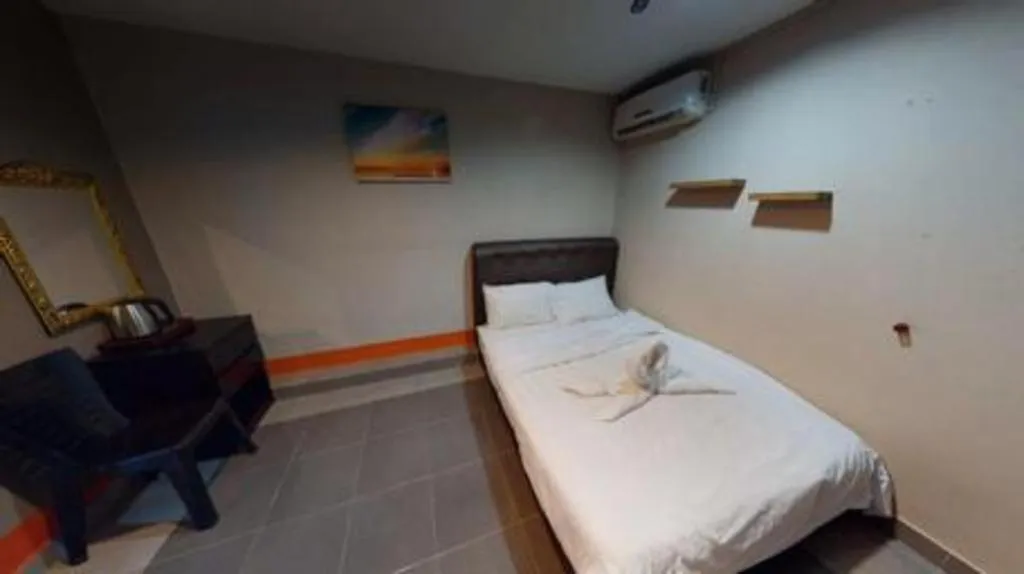 Bed in AMT BUDGET HOTEL