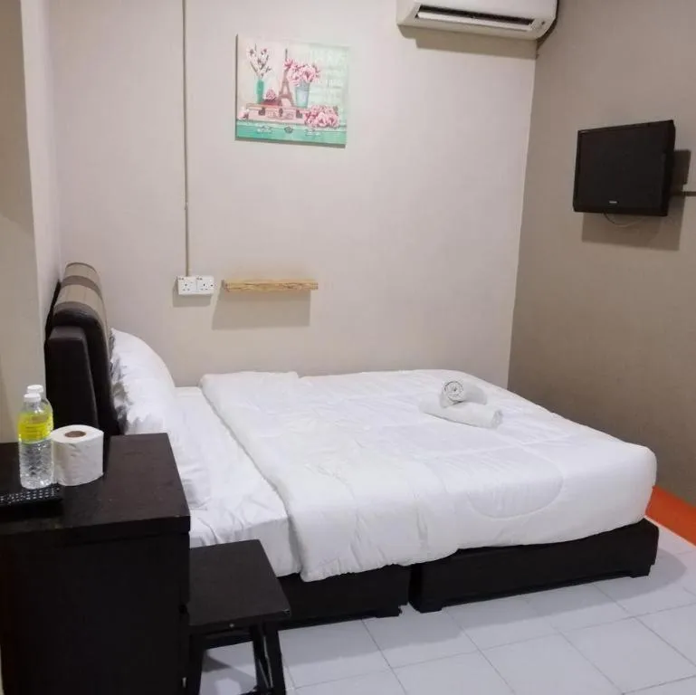 Bed in AMT BUDGET HOTEL