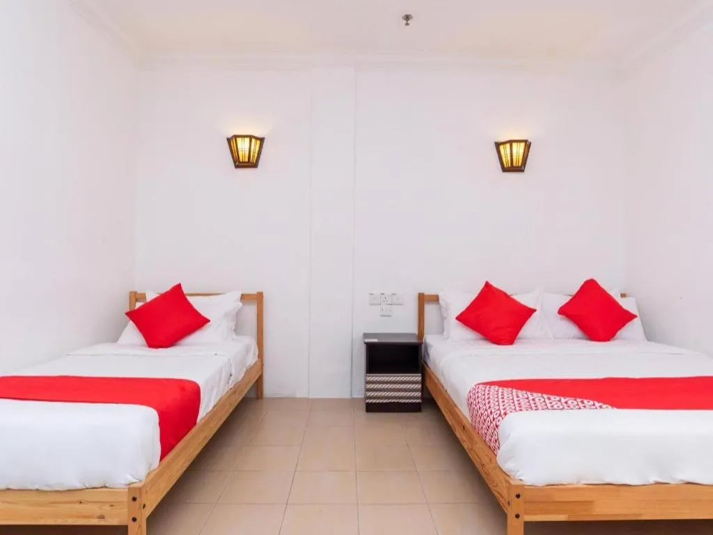 Bed in Super OYO 1114 Neo Pegasus Hotel