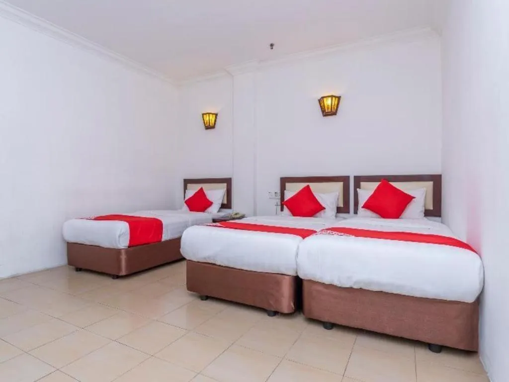 Bed in Super OYO 1114 Neo Pegasus Hotel