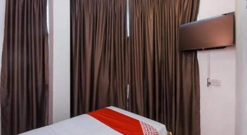 Bed in OYO 1111 Harmony Stay