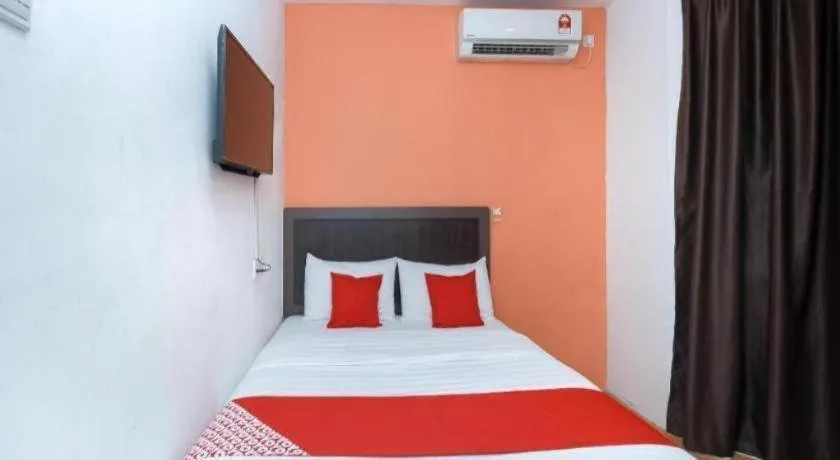 Bed in OYO 1111 Harmony Stay