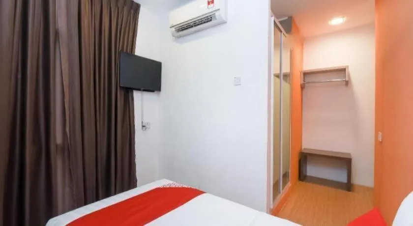 Bed in OYO 1111 Harmony Stay