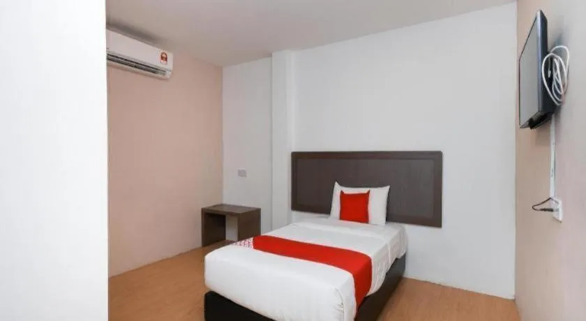 Bed in OYO 1111 Harmony Stay