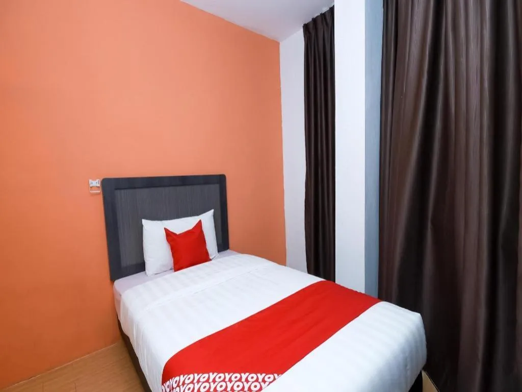 Bed in OYO 1111 Harmony Stay