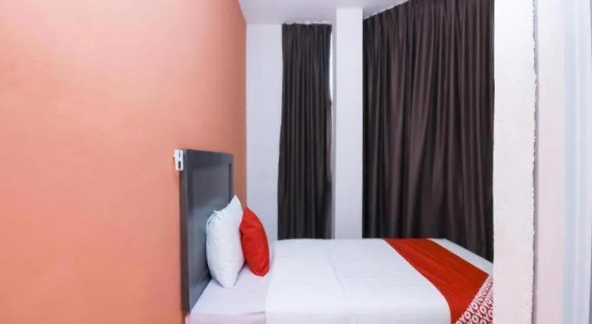 Bed in OYO 1111 Harmony Stay