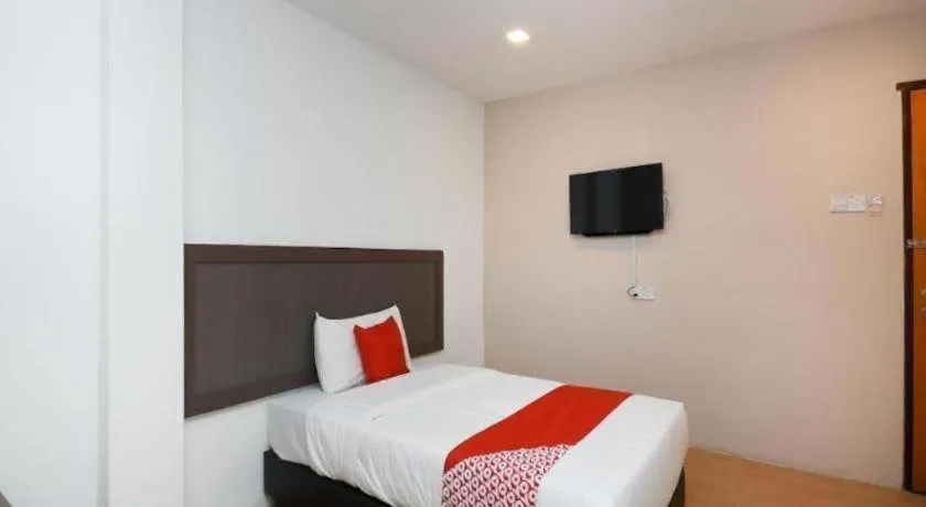 Bed in OYO 1111 Harmony Stay