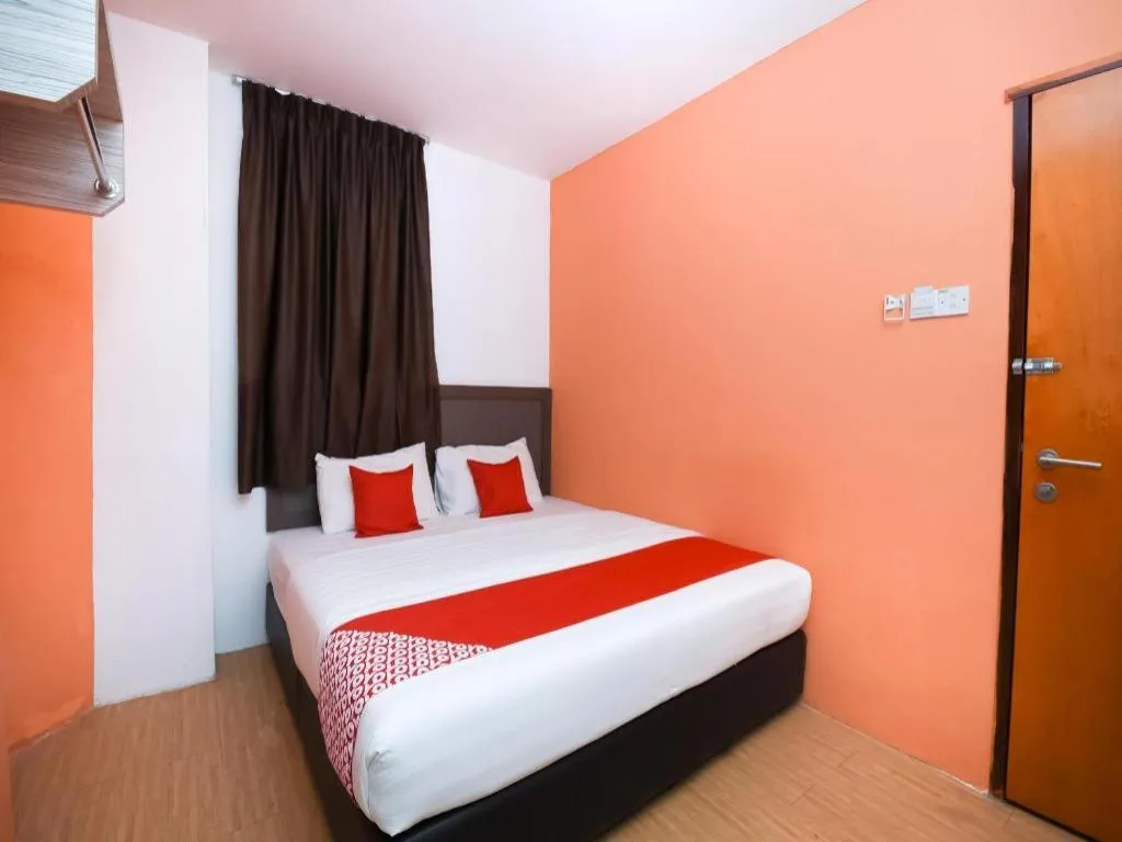 Bed in OYO 1111 Harmony Stay