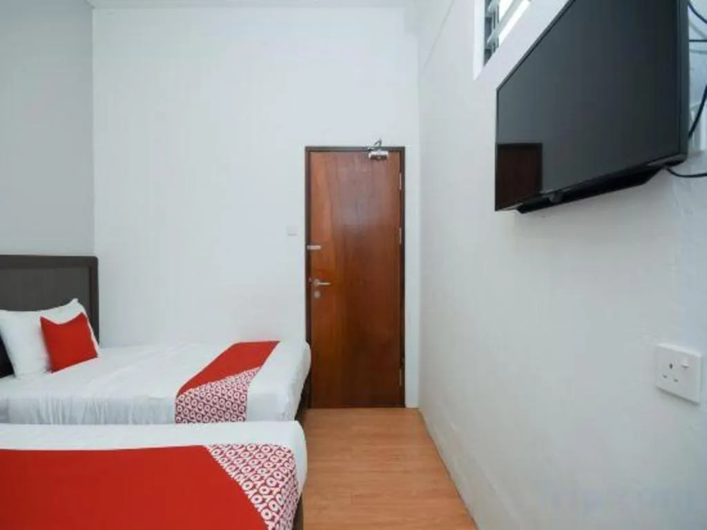 Bed in OYO 1111 Harmony Stay