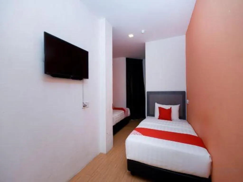 Bed in OYO 1111 Harmony Stay