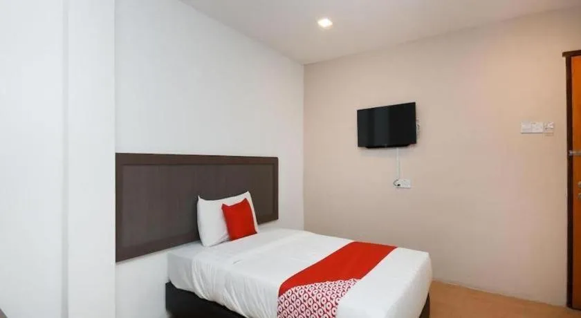 Bed in OYO 1111 Harmony Stay