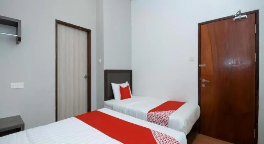 Bed in OYO 1111 Harmony Stay