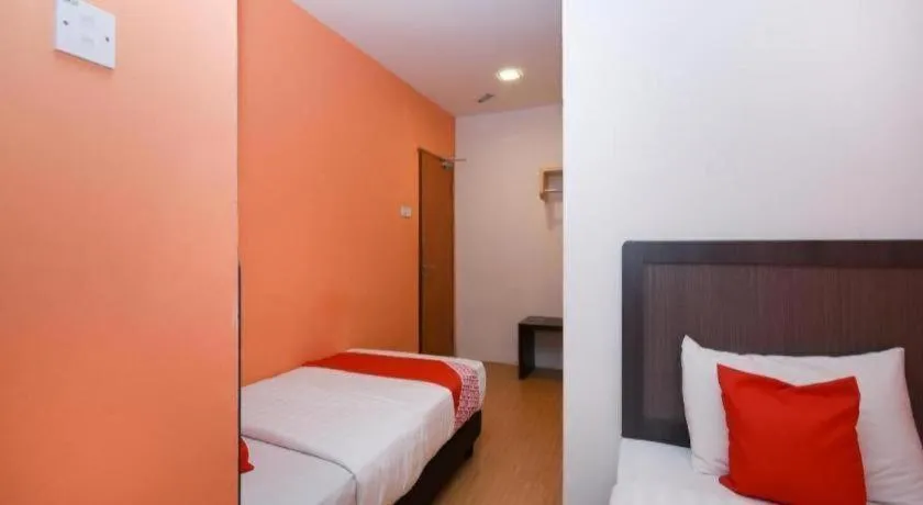 Bed in OYO 1111 Harmony Stay