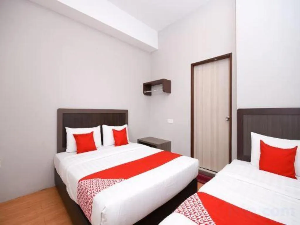 Bed in OYO 1111 Harmony Stay