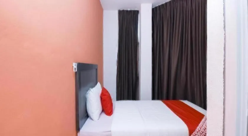 Bed in OYO 1111 Harmony Stay