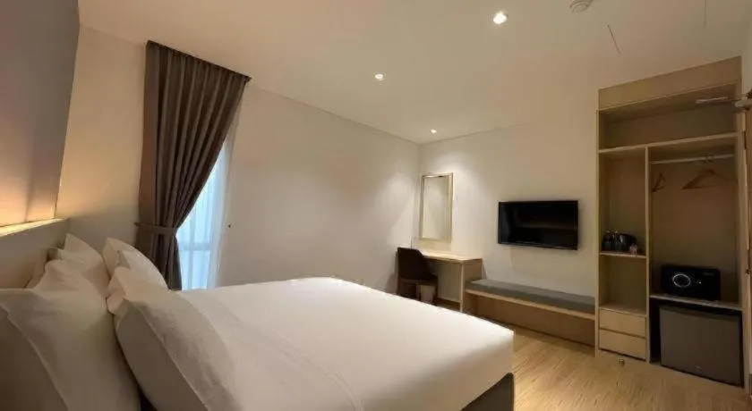 Bed in MIYABI HOTEL PERMAS