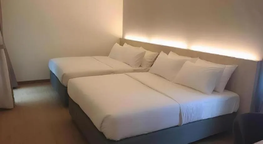 Bed in MIYABI HOTEL PERMAS