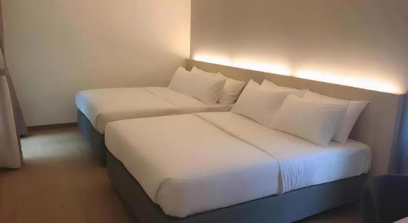 Bed in MIYABI HOTEL PERMAS