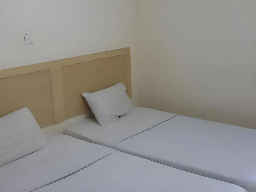 Bed in OYO 301 River Inn Hotel Bed in OYO 301 River Inn Hotel