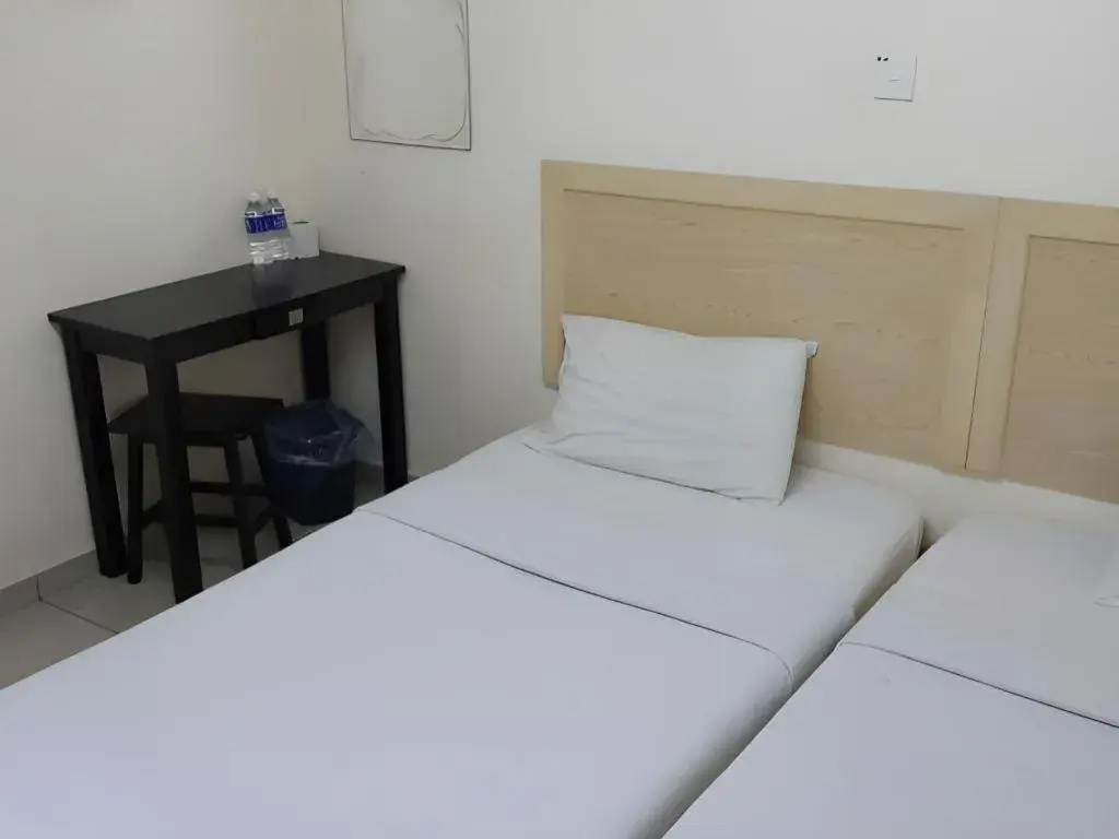 Bed in OYO 301 River Inn Hotel Bed in OYO 301 River Inn Hotel