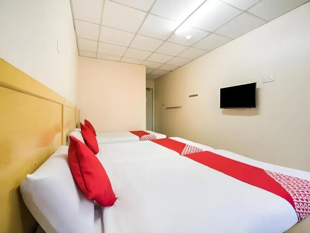 Bed in OYO 301 River Inn Hotel Bed in OYO 301 River Inn Hotel