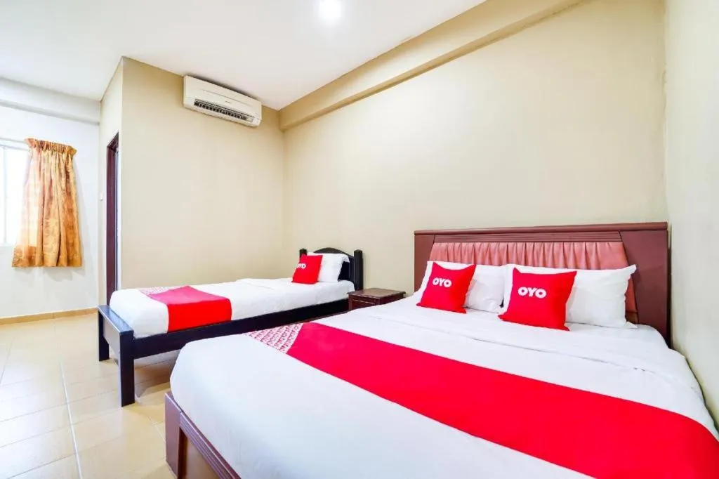 Bed in OYO 44058 MOTEL SRE BAYAM