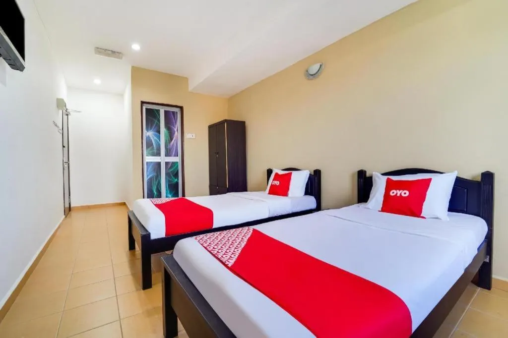 Bed in OYO 44058 MOTEL SRE BAYAM