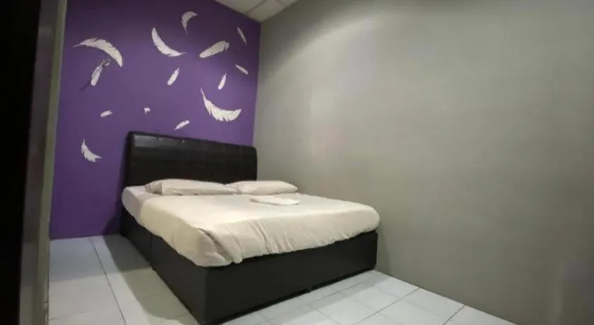 Bed in OYO 89760 Harmoni Inn Hotel