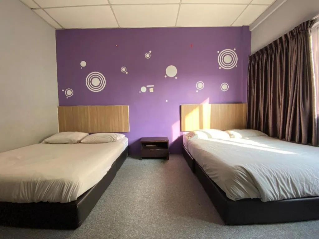 Bed in OYO 89760 Harmoni Inn Hotel